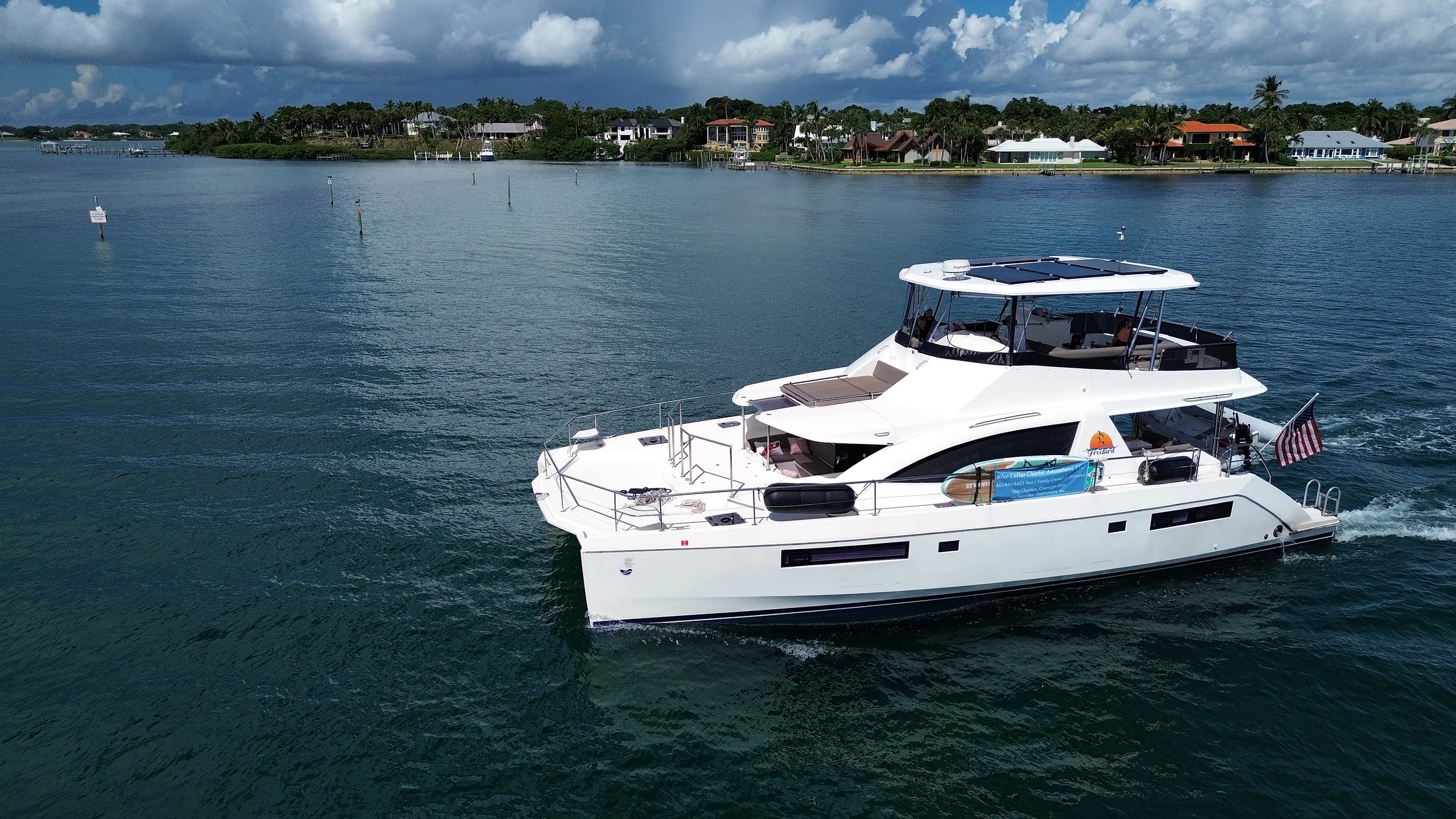 Freebird underway on calm coastal water, photographed from above